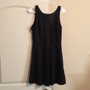 Divided high neck low V backed thigh dress